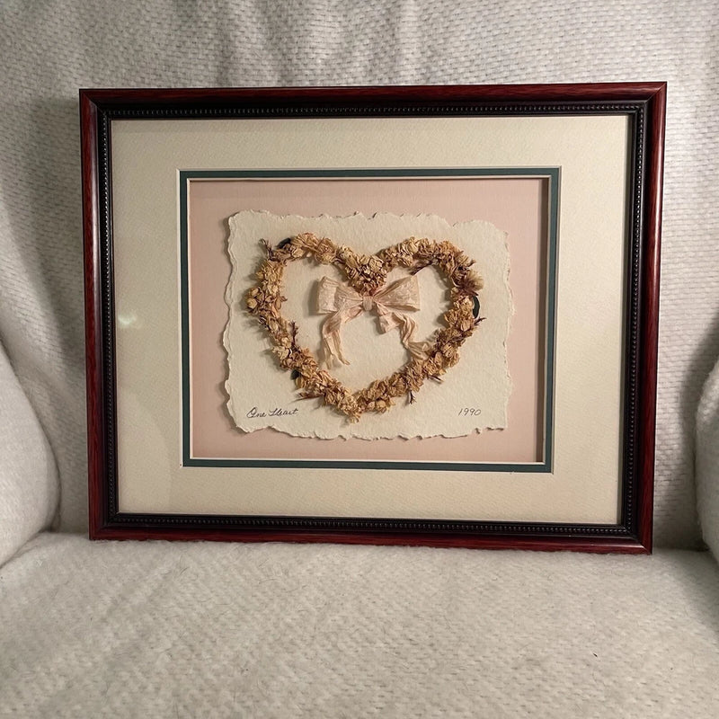 Framed dried flower heart wreath with bow, pressed petals in warm brown tones