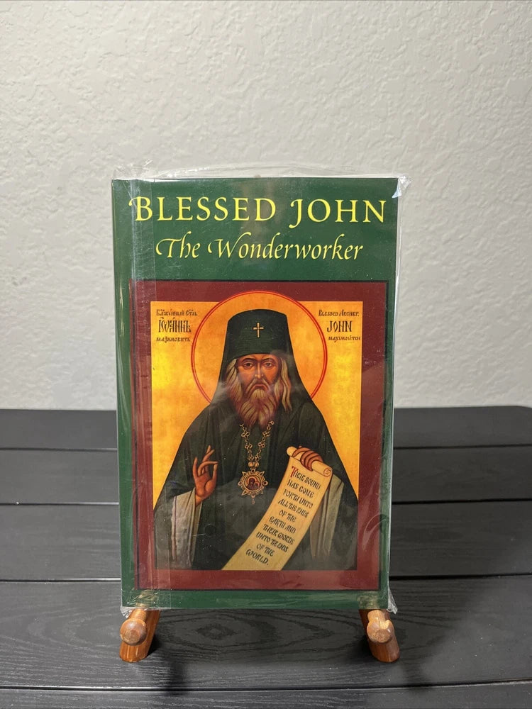 Green hardcover book with illustrated icon of Blessed John on front cover