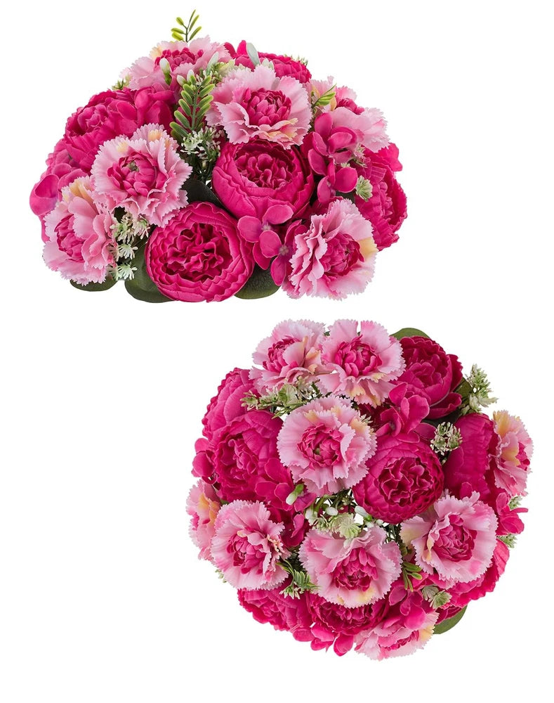 Hot pink and pink peony flower table centerpiece with clustered blooms and green leaves