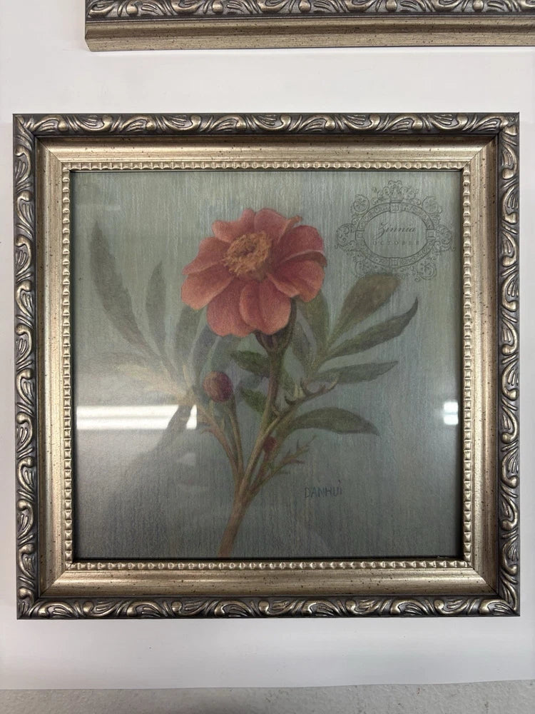Framed dried flower botanical wall art with red-orange bloom and green leaves