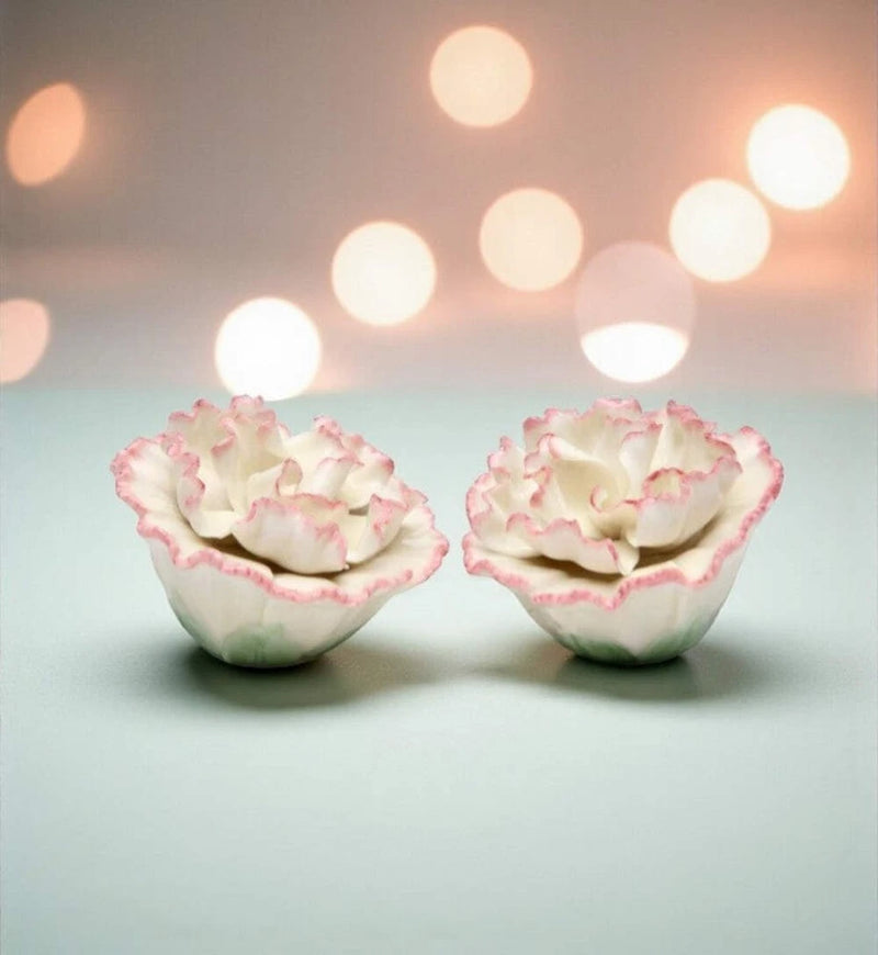 Ceramic carnation-shaped salt and pepper shakers with pink-and-white ruffled petals