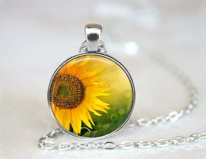 Sterling silver sunflower charm pendant necklace with round glass cabochon