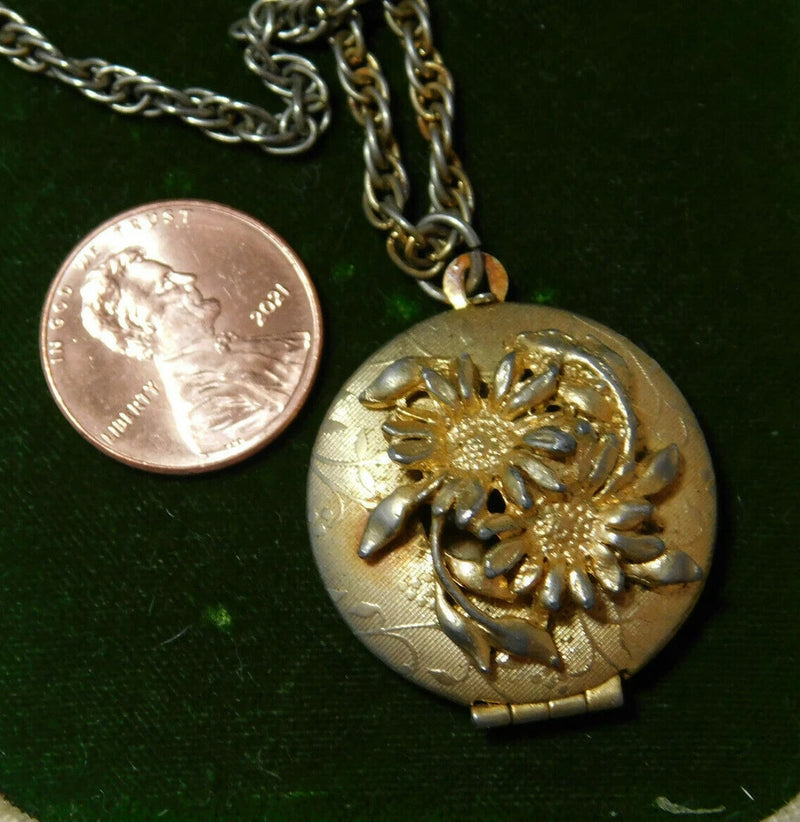 Gold-tone hinged sunflower locket pendant on chain necklace, round floral embossed front