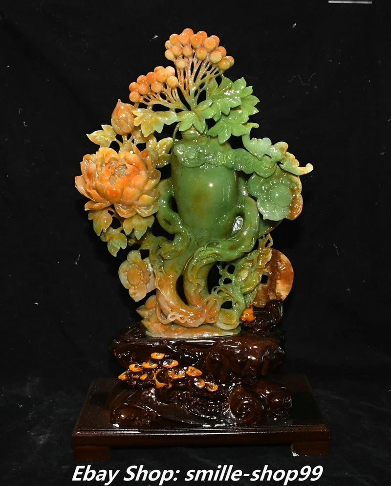 Carved green jade ruyi vase statue with peony and blossoms on a wooden base
