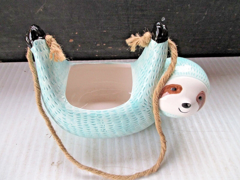Hanging koala ceramic flower pot in light blue with rope handle and cutout front