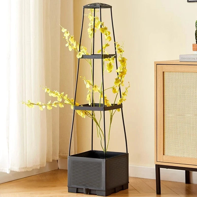 Self-watering raised garden bed with black adjustable trellis and square planter