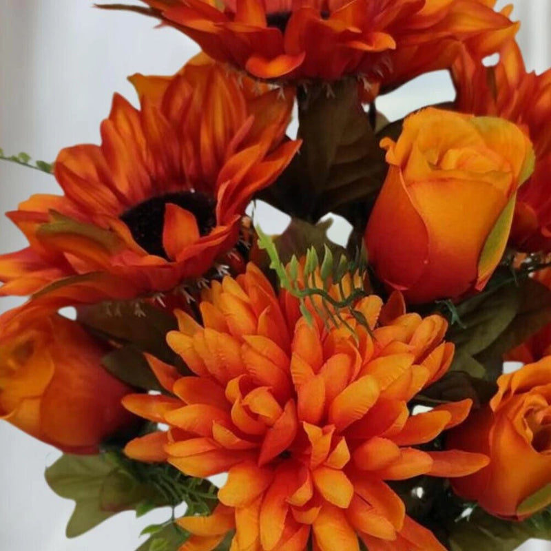 Artificial orange floral bush with mums, sunflower, and rose blooms