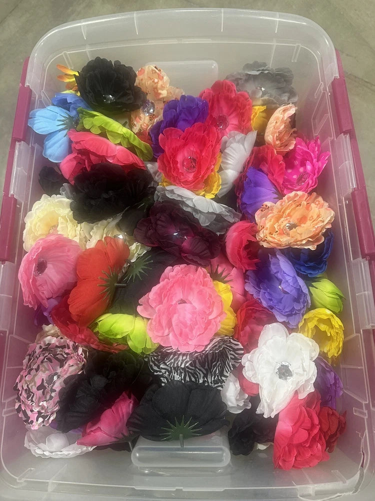 Peony flower heads lot in clear plastic box, assorted multicolor and patterned blooms