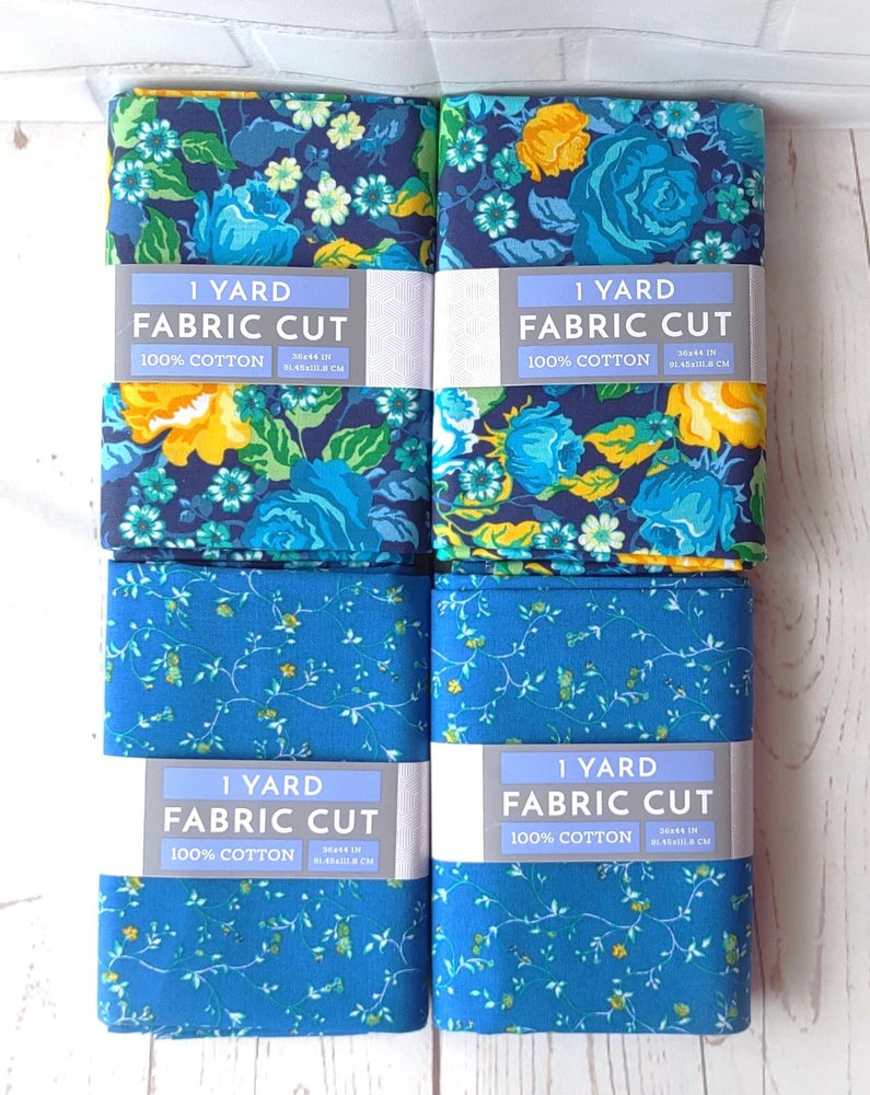Blue cotton fabric bundle with floral roses and vines, multiple 1-yard cut pieces