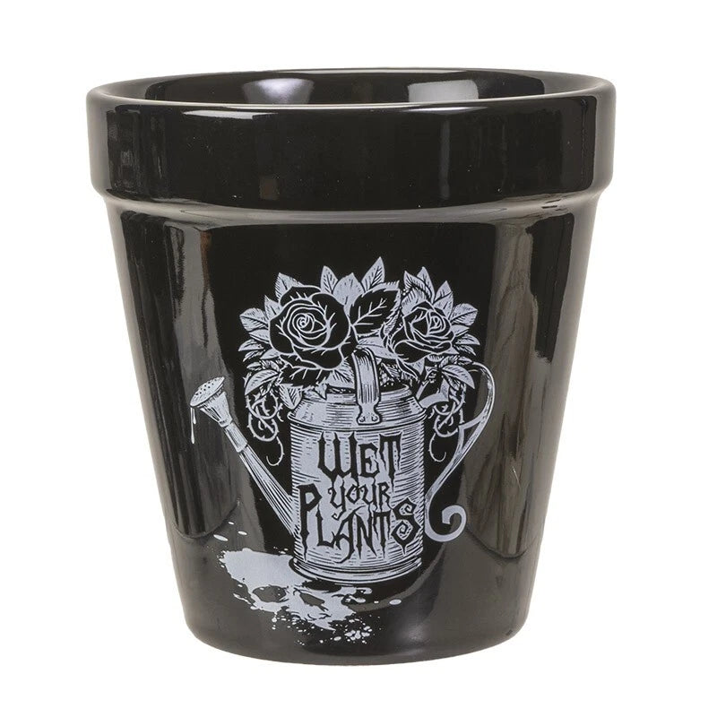 Black ceramic garden plant pot with floral watering can graphic and distressed print