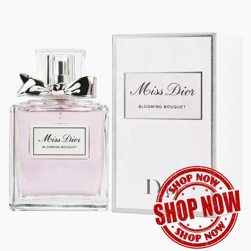 Eau de parfum spray bottle with boxed packaging, clear glass and silver cap.
