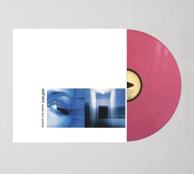 Opaque pink vinyl LP with open cover, showing blue artwork on the inner sleeve