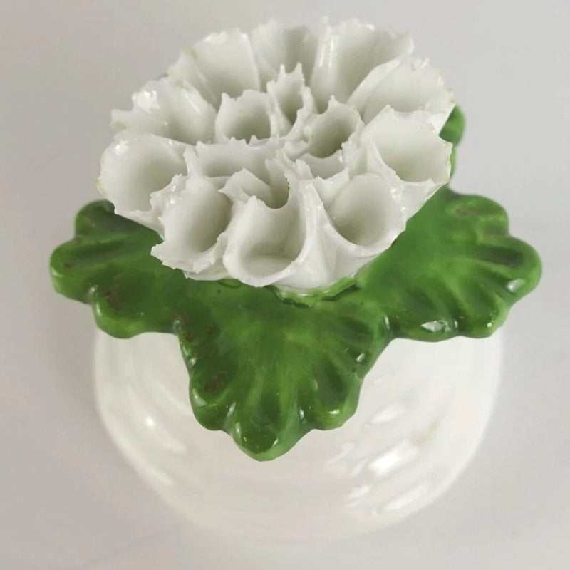 Porcelain pepper shaker with white carnation and green floral relief base