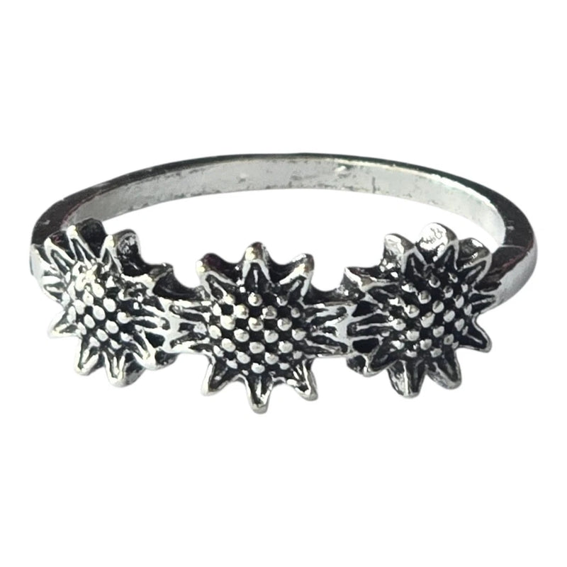 Silver-tone ring with three engraved sunflower motifs and dark marcasite-like dots