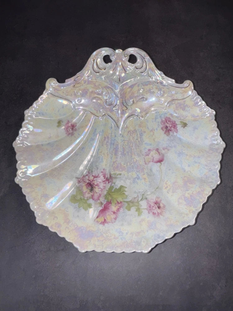 Iridescent shell dish with scalloped rim and pink carnation flower decoration