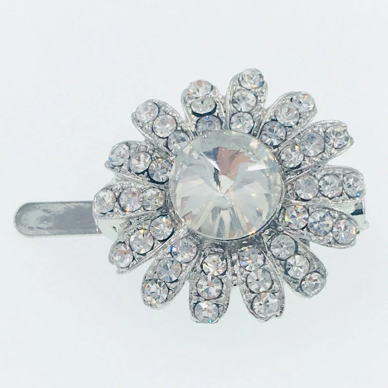 Silver rhinestone sunflower barrette with large round crystal center and sparkly petals