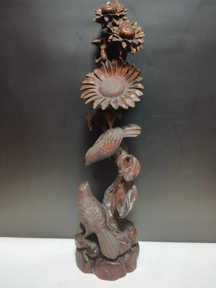 Woodcarved magpie and sunflower desktop statue with layered petals and leaf detail