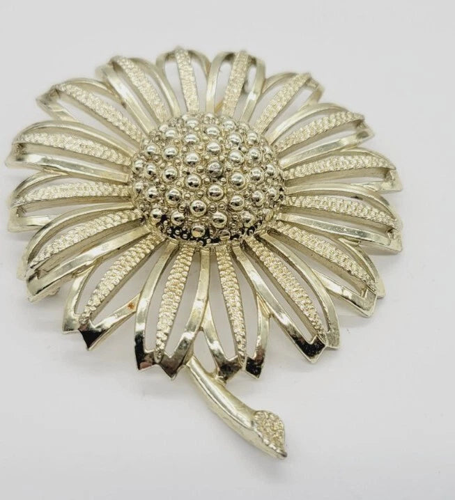 Pale gold tone sunflower brooch pin with textured petals and bead-like center