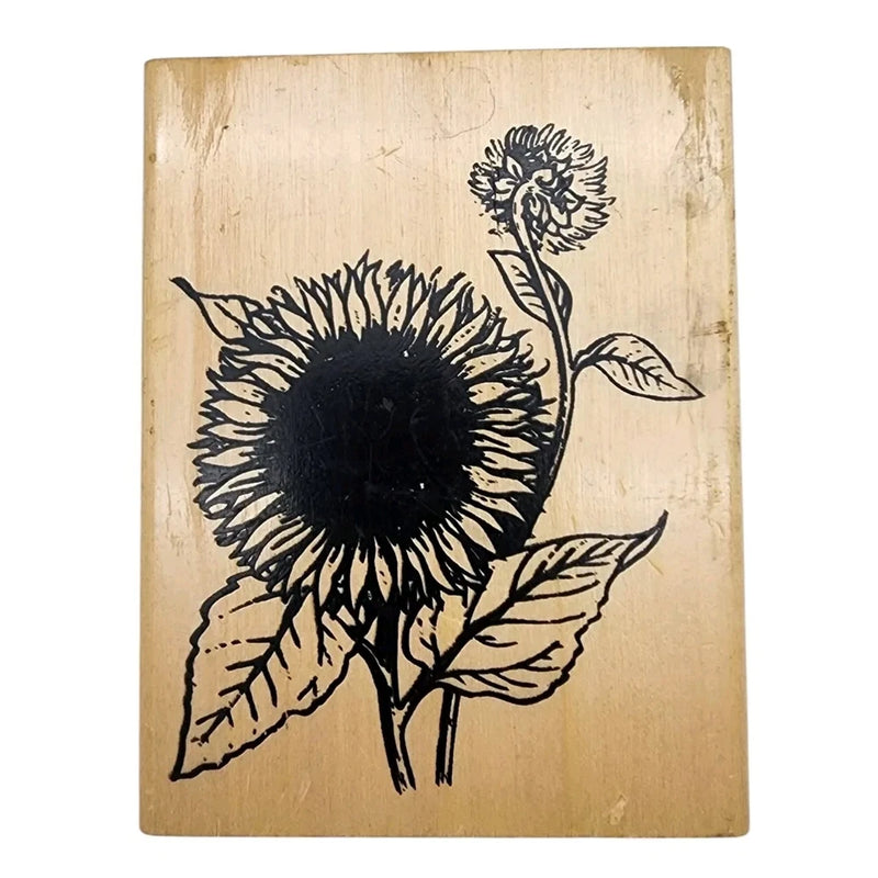 Wood-mounted sunflower rubber stamp with black botanical line art on tan block