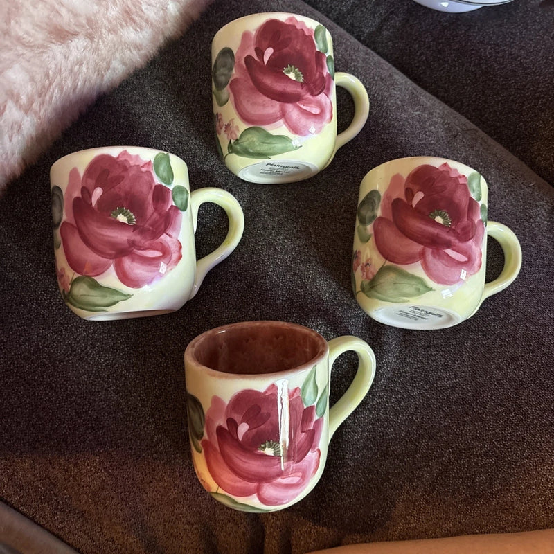 Set of four ceramic mugs with pink peony floral design and light yellow handles