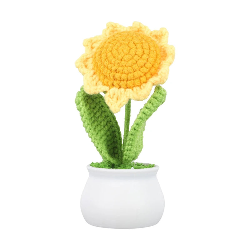 Handcrafted yarn sunflower decor with yellow bloom, green stem leaves in white pot