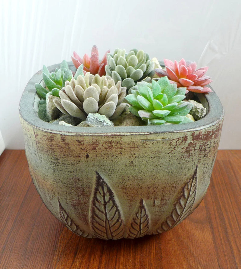 Decorative planter with set of artificial mini succulents in green and pink tones