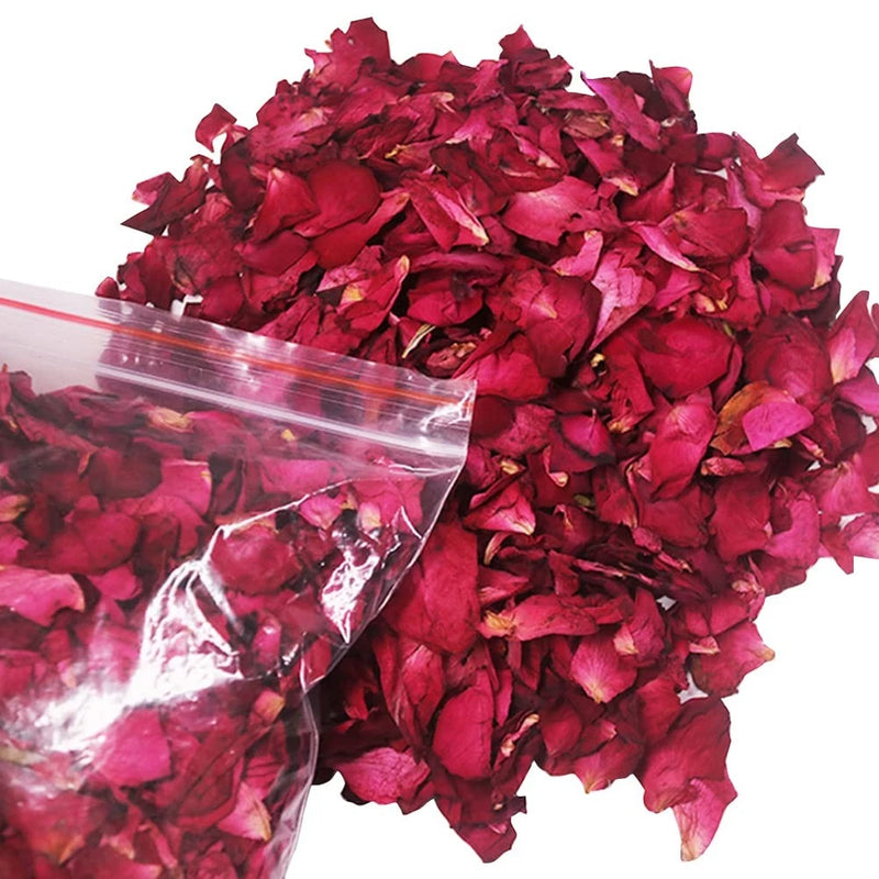 Dried red rose petals in clear plastic pouch, loose scattered petals