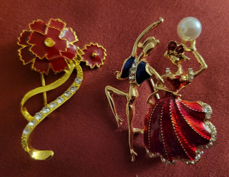 Rhinestone flower and ballerina brooches, gold-tone with red dress and pearl accents