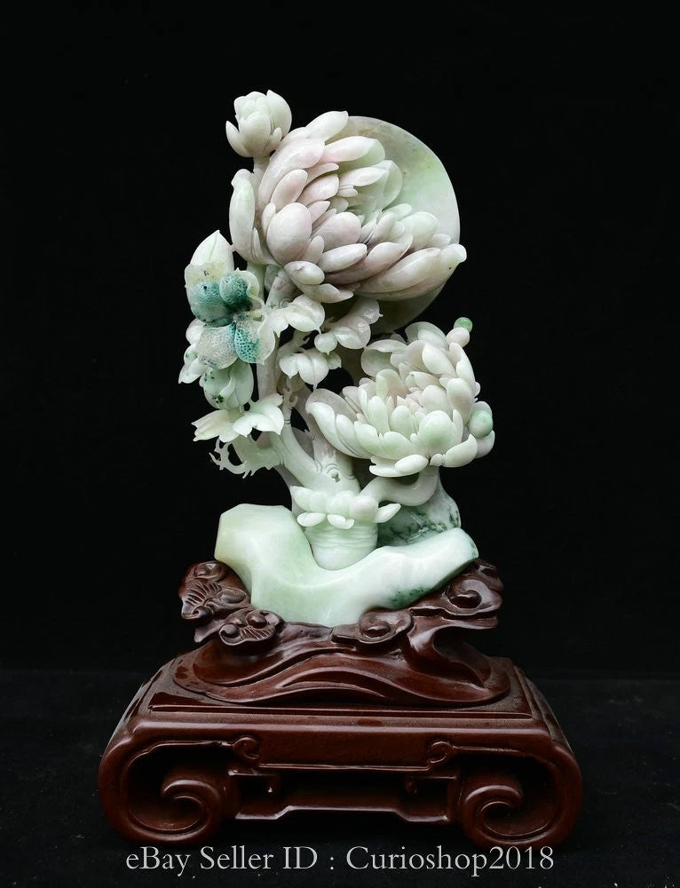 Carved jade peony flower moon sculpture with white blossoms on a turquoise base