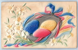 Easter Greetings Eggs Nest And Lilies Flowers Embossed Airbrushed Postcard Lily