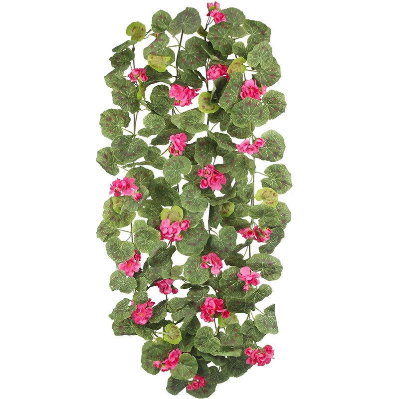 Artificial flower garland with pink geranium-style blooms and green leaf vines