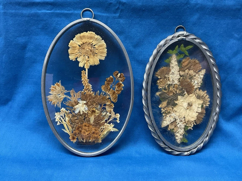 Oval suncatcher set with pressed dried flowers in metal frames and hanging loops