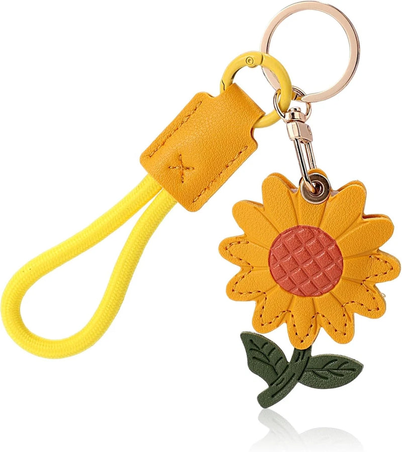 Yellow sunflower leather Airtag keychain with key ring, clasp, and leaf charm