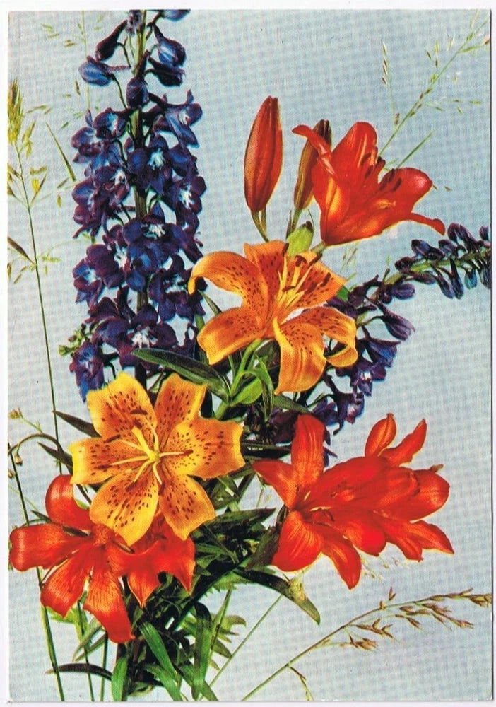 Floral postcard bouquet with orange lilies and blue larkspur
