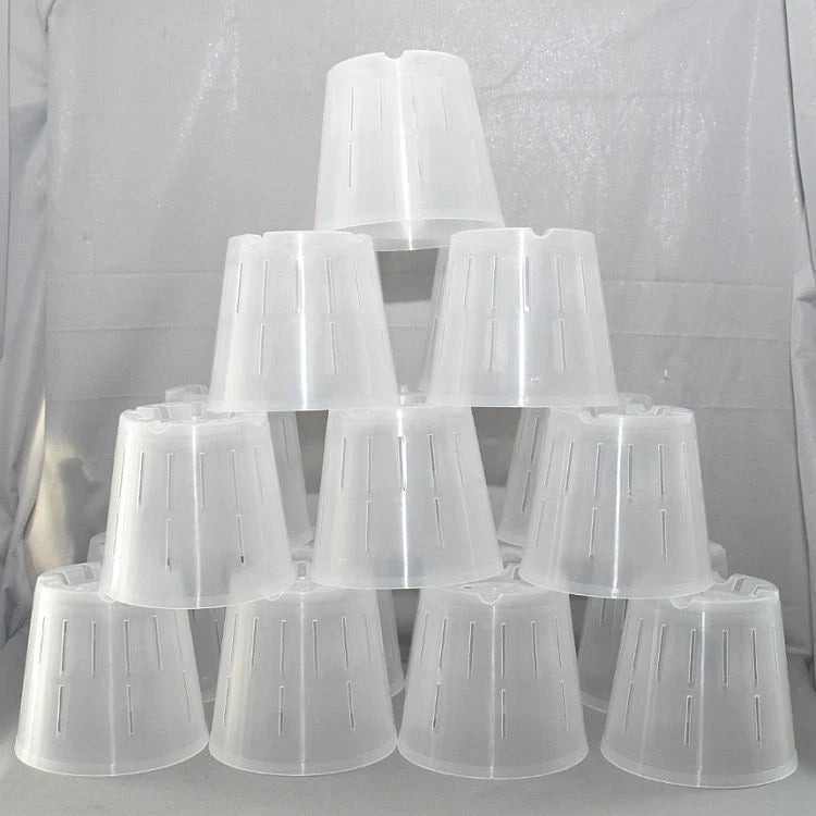 Set of clear round plastic orchid pots, stacked.