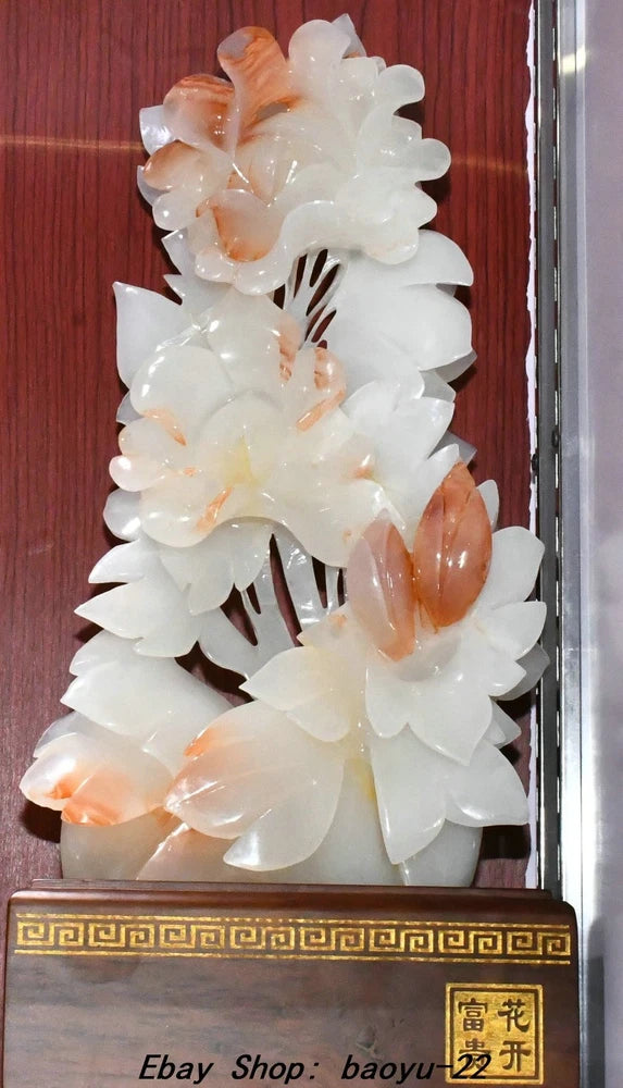 Carved jade peony flower tree statue with white blossoms and warm orange accents