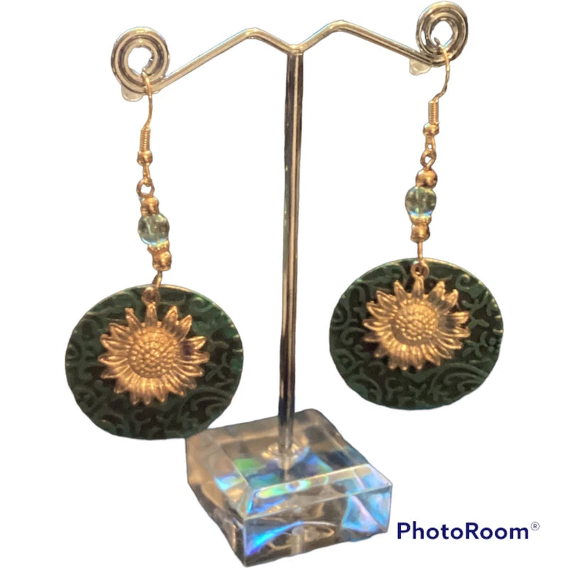Gold-tone sunflower earrings with dark green round discs and dangling beads