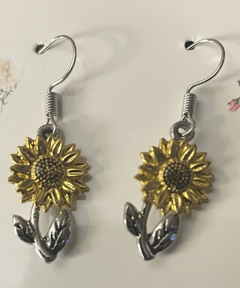 Sunflower drop earrings on silver fishhooks, gold sunflower charms with dark petal accents