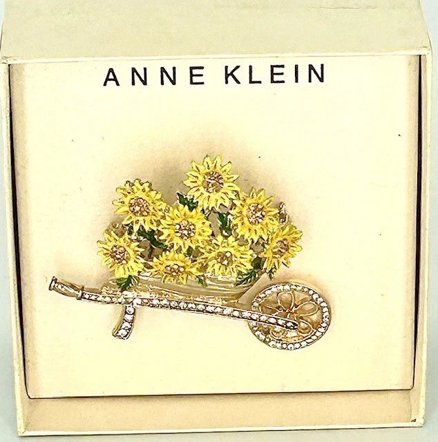 Sunflower wheelbarrow brooch pin with rhinestone accents and gold-tone wheel
