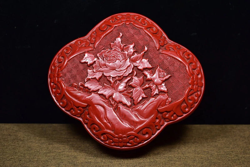 Red heart-shaped lacquer jewelry box with raised peony flower relief