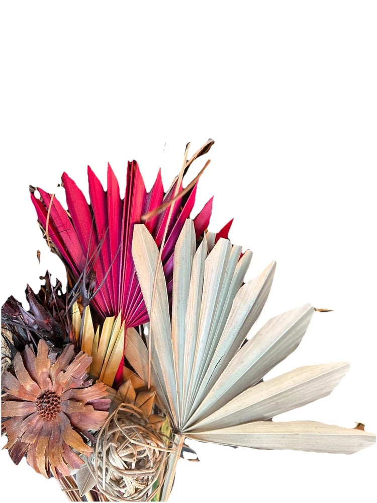 Large dried tropical bouquet with burgundy accents and palm fronds