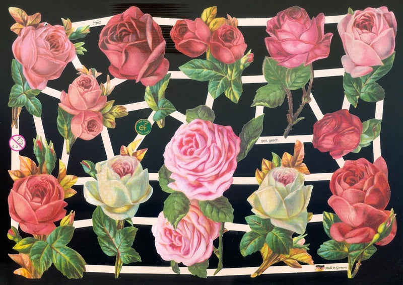 Mixed Victorian die-cut paper rose scraps with pink red cream blooms and green leaves