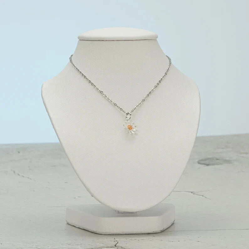 Sterling silver sunflower pendant necklace with small yellow center on a delicate chain
