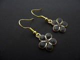 A PAIR PRETTY BLACK ENAMEL DAISY FLOWER THEMED DANGLY EARRINGS. NEW. Daisies
