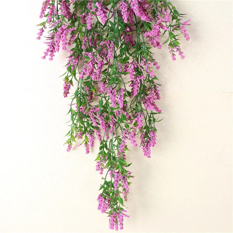 Hanging faux dried flower plant decoration with cascading purple blossoms