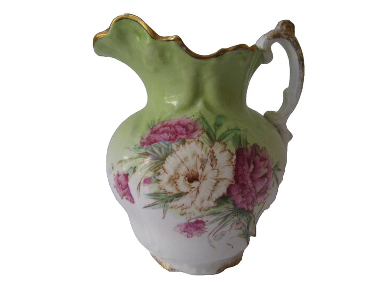 Handmade ceramic pitcher with green top, floral pink bouquet, and gold trim