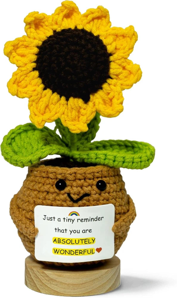 Handmade crocheted sunflower doll with quote card reading 'ABSOLUTELY WONDERFUL!'