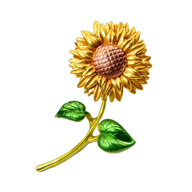 Sunflower brooch pin with gold enamel petals, pink textured center, green leaf details