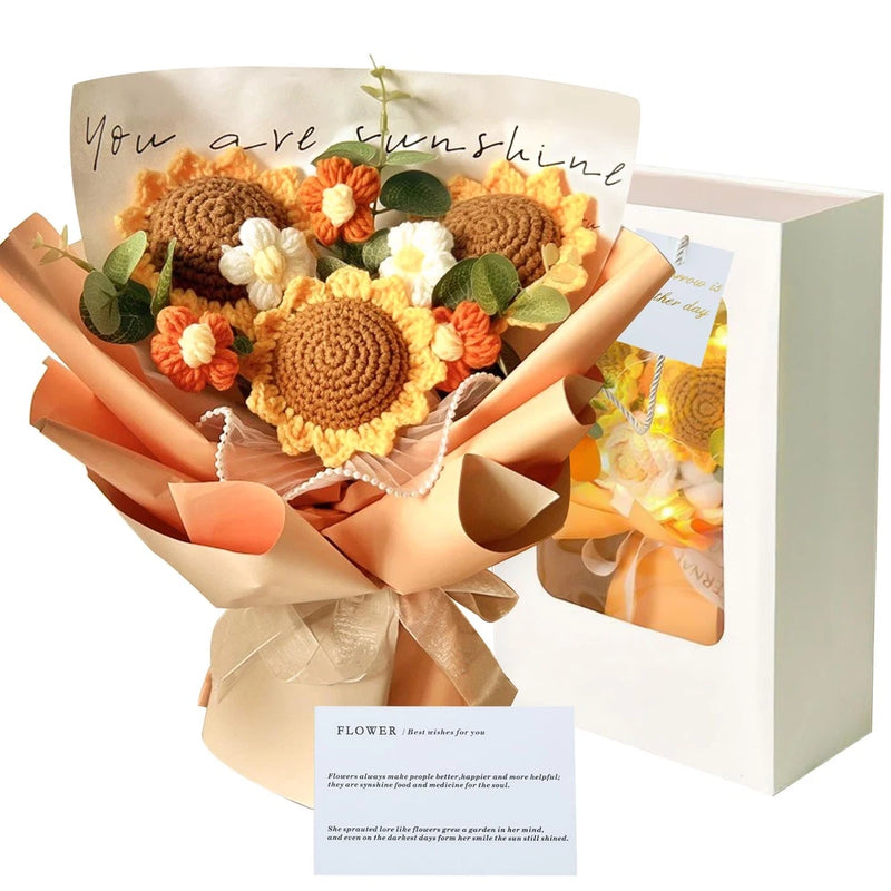 Crochet sunflower plush bouquet with knitted flowers and green leaves in ribbon wrap