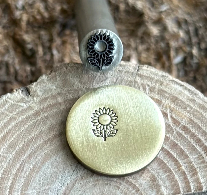 Round sunflower metal stamp punch with engraved flower design and stamped top die